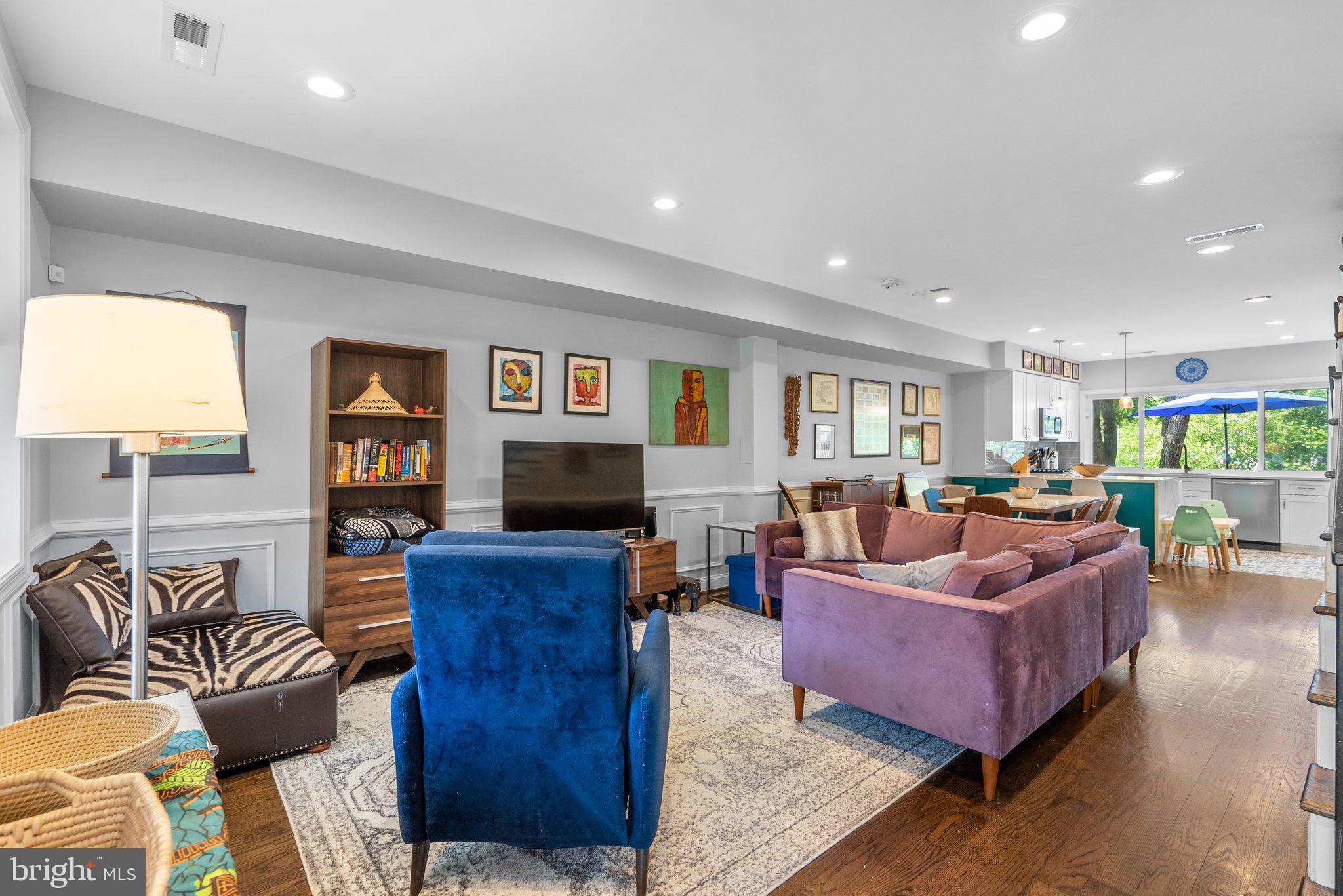 1275 Oates Street Northeast Washington, DC 20002 - Photo 3 of 40 a living room with furniture and a flat screen tv