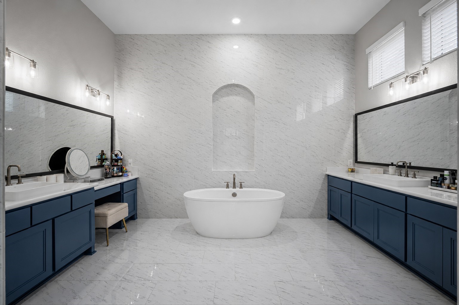 4923 Grapevine Lane Manvel, TX 77578 - Photo 25 of 49 a bathroom with a double vanity sink a mirror and a bathtub