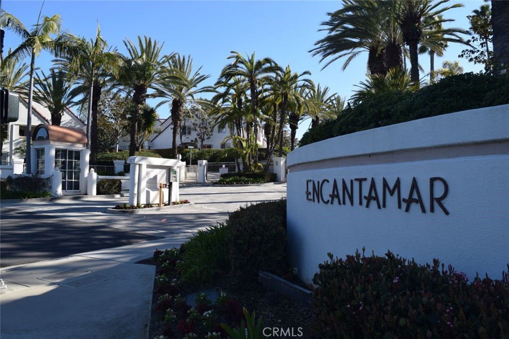 a street sign on a sidewalk next to a road