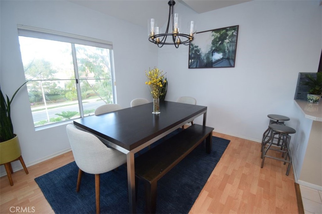 17 La Paloma Dana Point, CA 92629 - Photo 14 of 36 a living room with dining table furniture a window and a flat screen tv