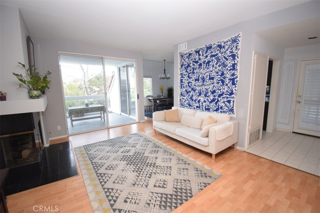 17 La Paloma Dana Point, CA 92629 - Photo 18 of 36 a living room with a couch and a fireplace