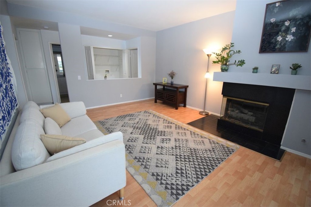 17 La Paloma Dana Point, CA 92629 - Photo 24 of 36 a living room with furniture and a fireplace