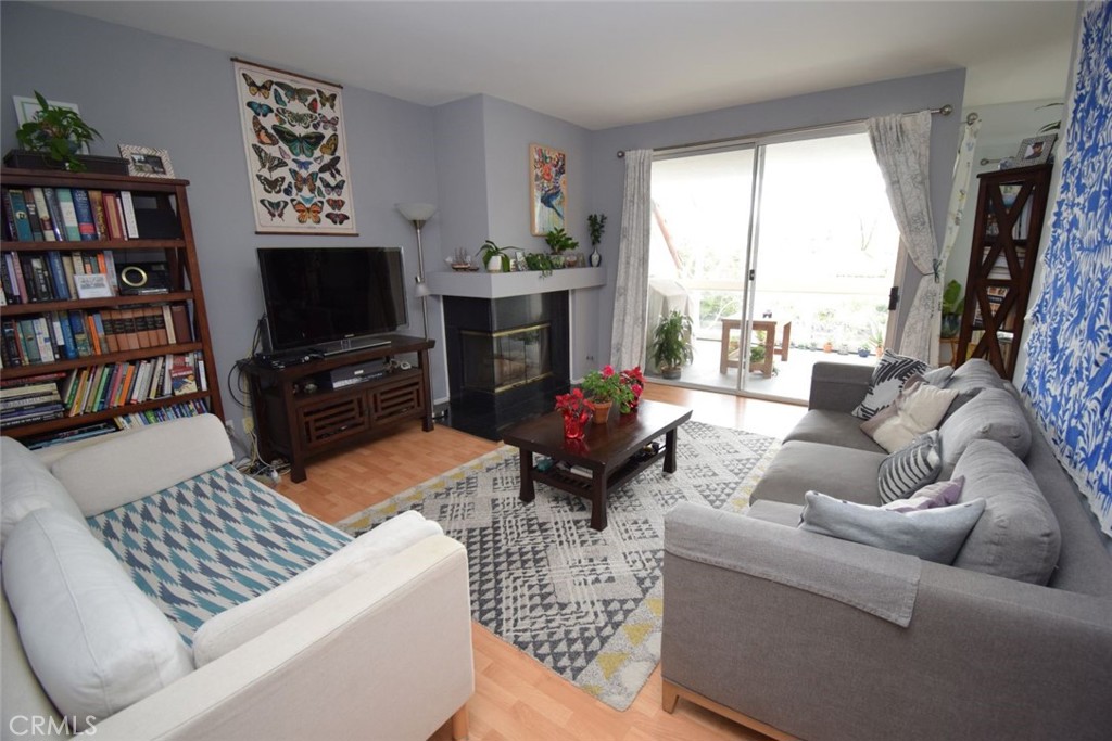 17 La Paloma Dana Point, CA 92629 - Photo 5 of 36 a living room with furniture a flat screen tv and a fireplace