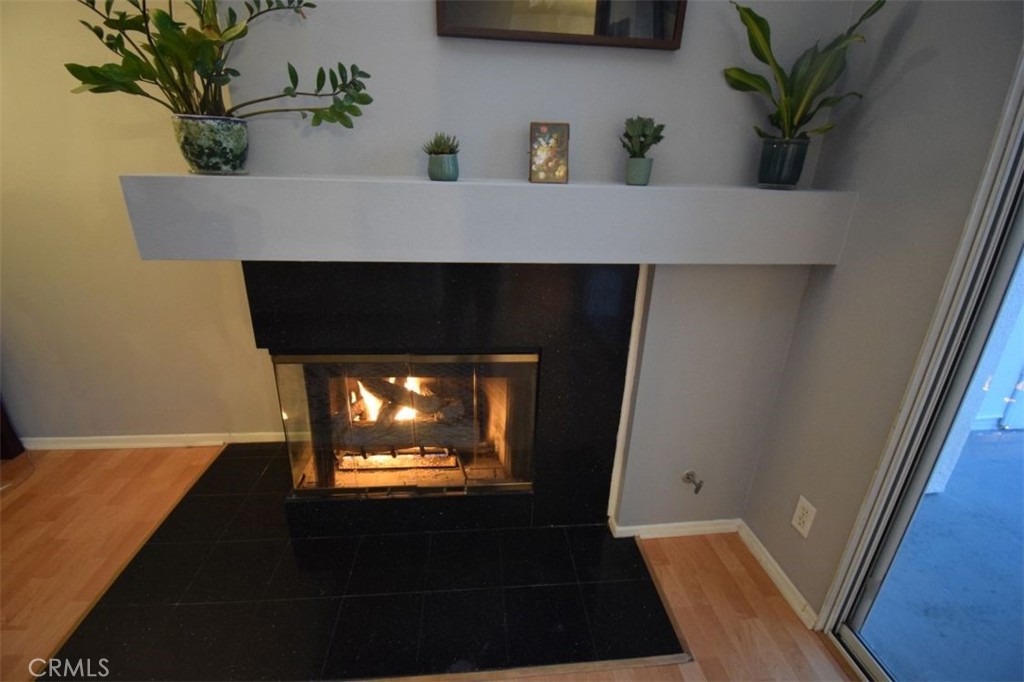 17 La Paloma Dana Point, CA 92629 - Photo 8 of 36 a room with a potted plant on a counter and a wooden floor