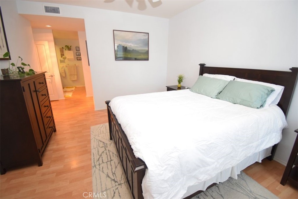 17 La Paloma Dana Point, CA 92629 - Photo 10 of 36 a bedroom with a bed and wooden floor