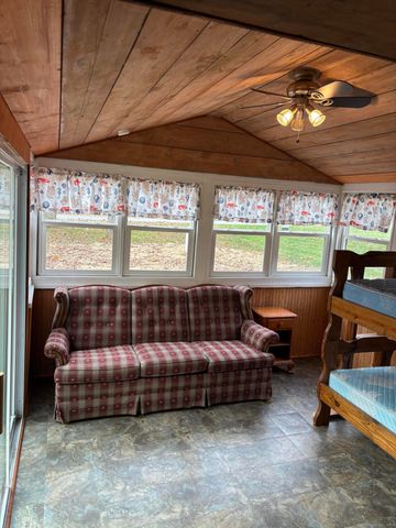 a bedroom with furniture and window