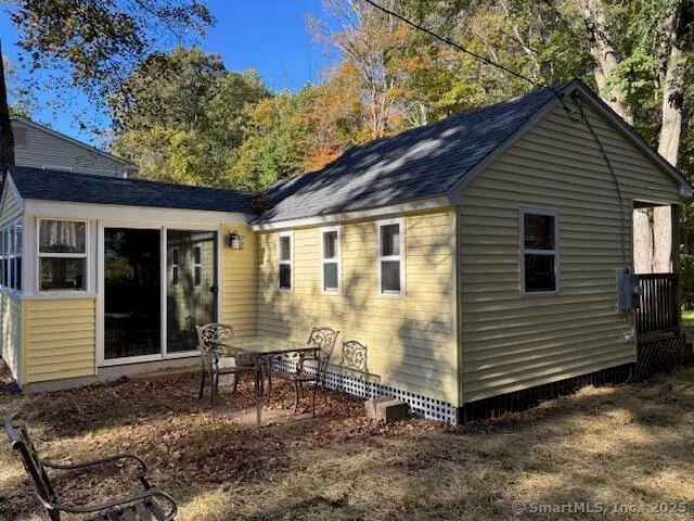 a view of a house with a yard and wooden floor