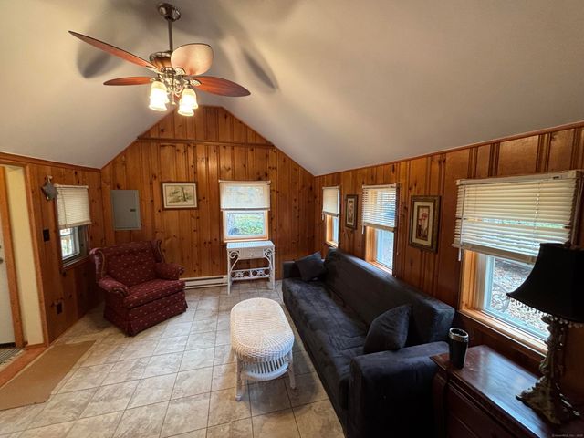 a living room with furniture and a window