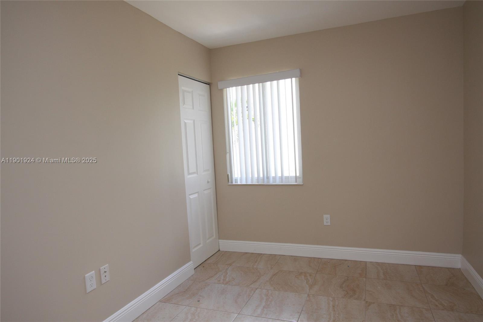 479 Northwest 19th Street, Unit 352 Miami, FL 33136 - Photo 5 of 16 an empty room with windows
