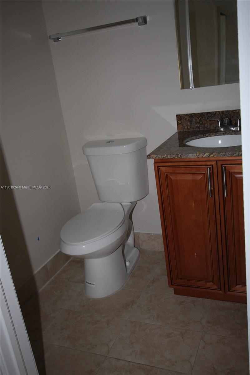 479 Northwest 19th Street, Unit 352 Miami, FL 33136 - Photo 6 of 16 a white toilet sitting next to a sink