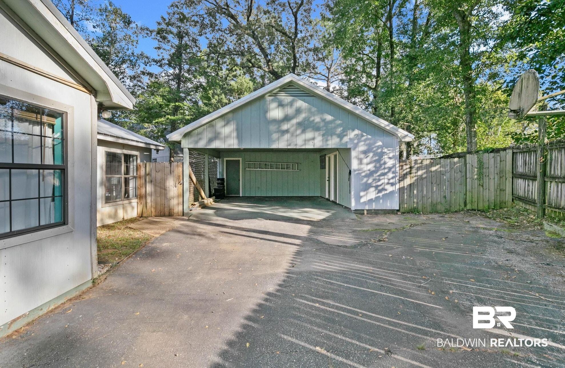 107 Rainer Circle Daphne, AL 36526 - Photo 26 of 31 Garage with driveway