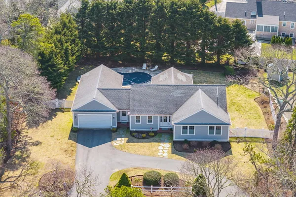an aerial view of a house with swimming pool