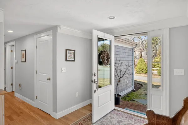 a view of entryway with wooden floor and door