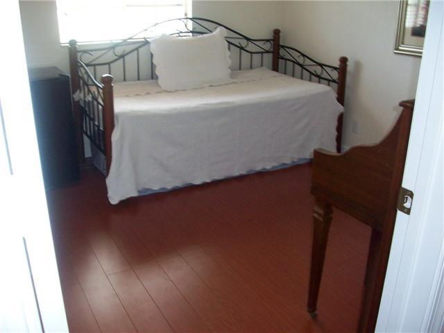 4508 Danson Way Delray Beach, FL 33445 - Photo 11 of 25 a bed sitting in a bedroom next to a small yard