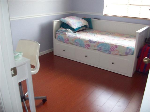 4508 Danson Way Delray Beach, FL 33445 - Photo 12 of 25 a bedroom with a bed and a mirror