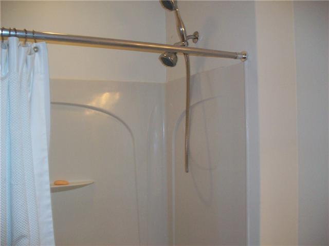 4508 Danson Way Delray Beach, FL 33445 - Photo 13 of 25 a bathroom with a glass shower door