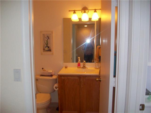 4508 Danson Way Delray Beach, FL 33445 - Photo 14 of 25 a bathroom with a toilet sink and mirror