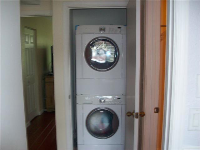 4508 Danson Way Delray Beach, FL 33445 - Photo 15 of 25 a view of a hallway with washer and dryer