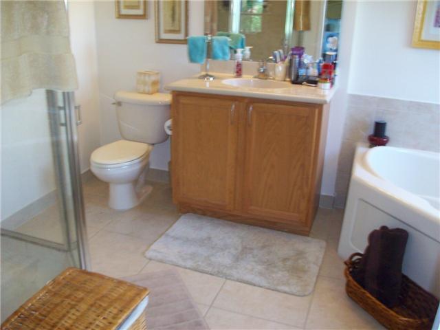 4508 Danson Way Delray Beach, FL 33445 - Photo 17 of 25 a bathroom with a sink toilet and a mirror