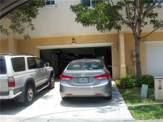 4508 Danson Way Delray Beach, FL 33445 - Photo 21 of 25 a view of outdoor space with cars parked