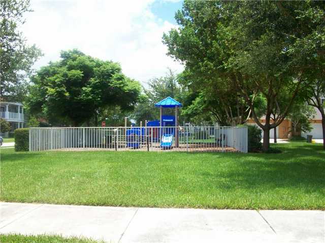 4508 Danson Way Delray Beach, FL 33445 - Photo 22 of 25 a backyard with table and chairs and a small yard