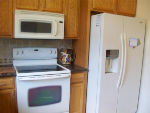 4508 Danson Way Delray Beach, FL 33445 - Photo 3 of 25 a stove top oven sitting inside of a kitchen