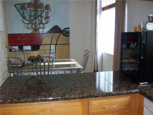 4508 Danson Way Delray Beach, FL 33445 - Photo 4 of 25 a view of a balcony with table and chairs