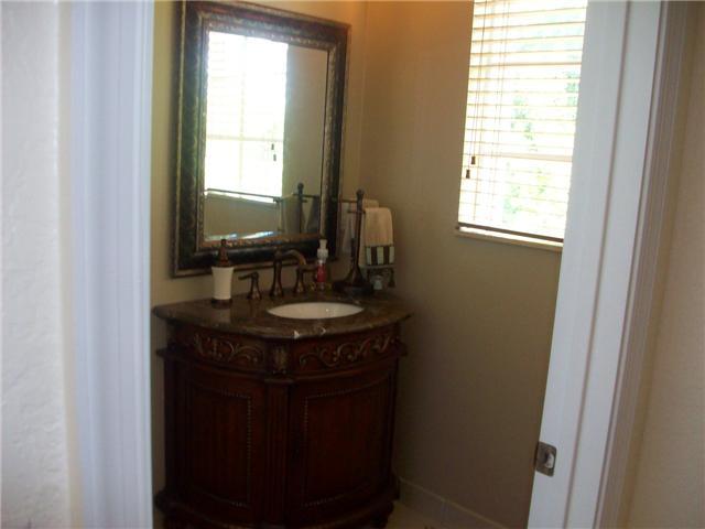 4508 Danson Way Delray Beach, FL 33445 - Photo 6 of 25 a sink with a mirror