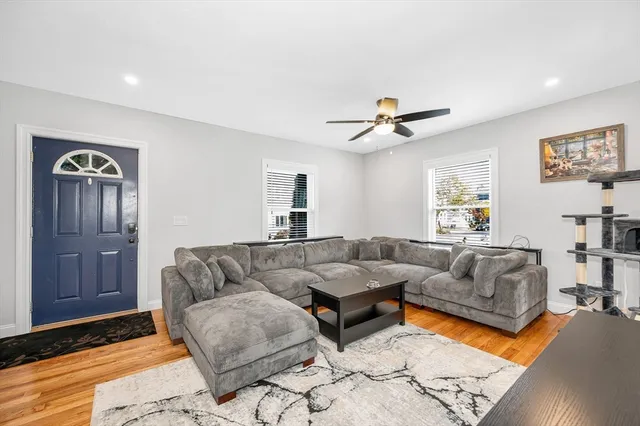 a living room with furniture and a rug