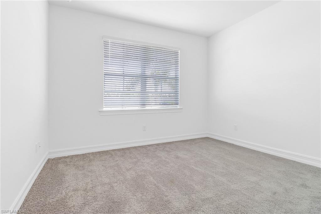 317 Spiaggio Court Naples, FL 34114 - Photo 12 of 46 an empty room with a window