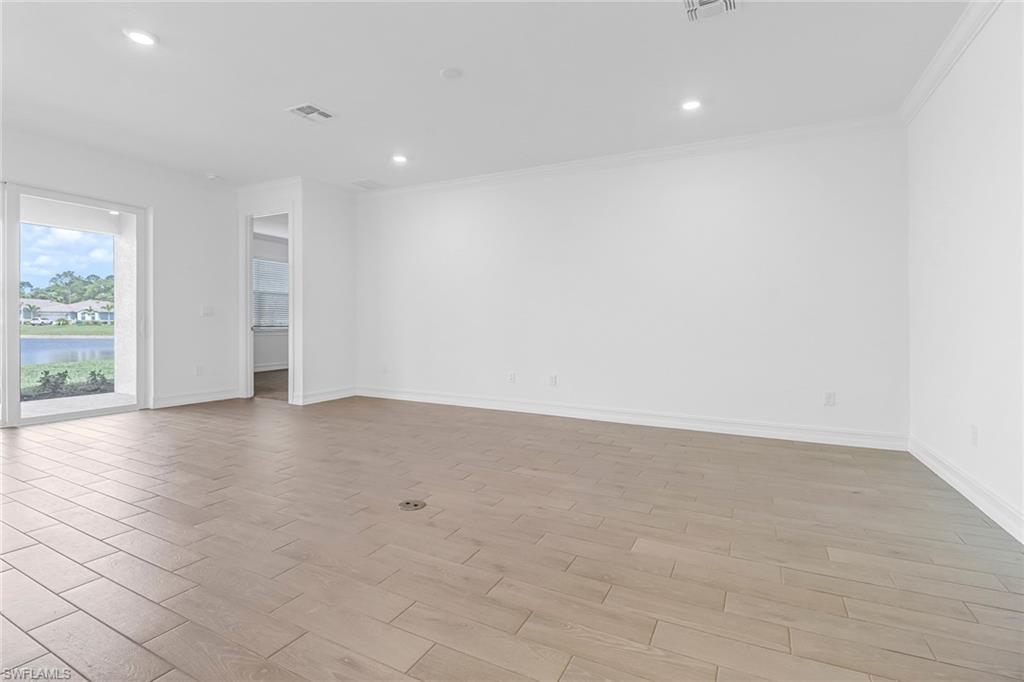 317 Spiaggio Court Naples, FL 34114 - Photo 22 of 46 an empty room with windows