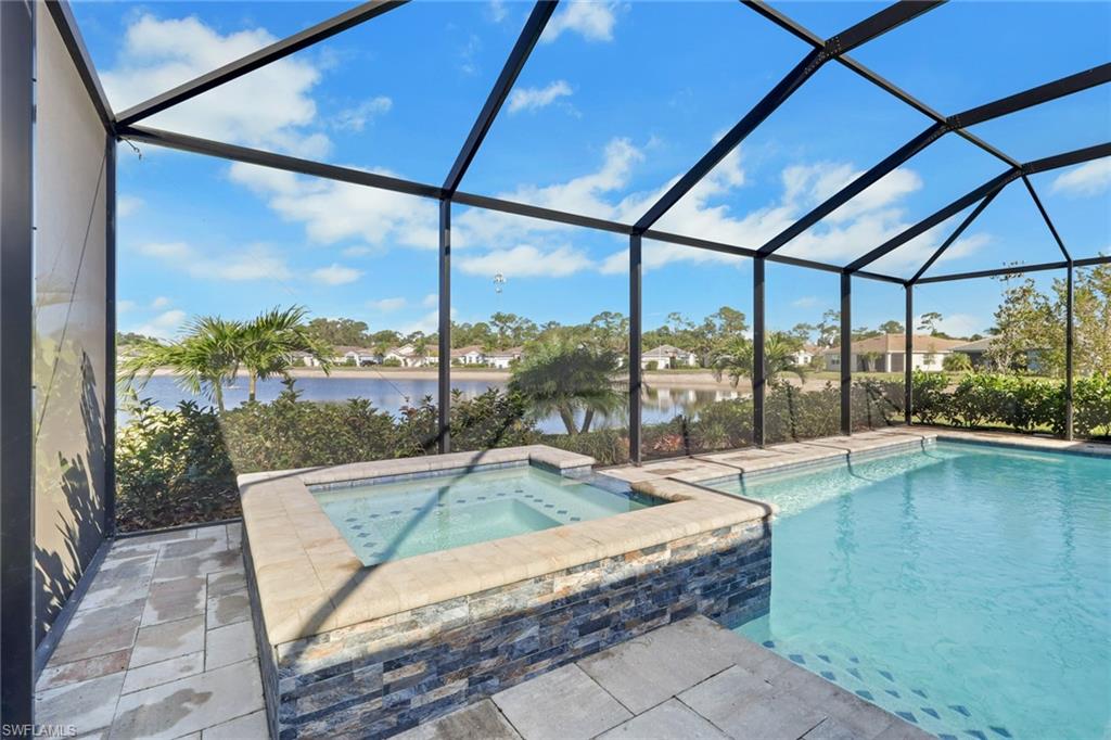 317 Spiaggio Court Naples, FL 34114 - Photo 28 of 46 a swimming pool with lake view