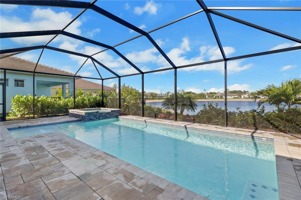 317 Spiaggio Court Naples, FL 34114 - Photo 30 of 46 a view of a swimming pool with a porch