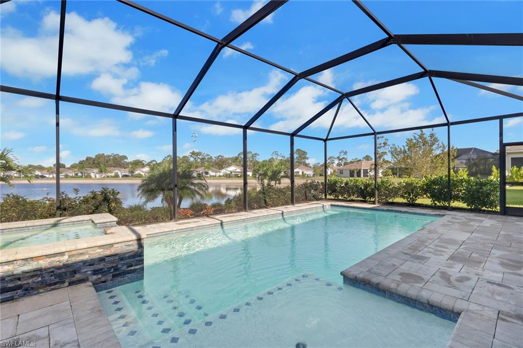 317 Spiaggio Court Naples, FL 34114 - Photo 32 of 46 a room with view of a swimming pool