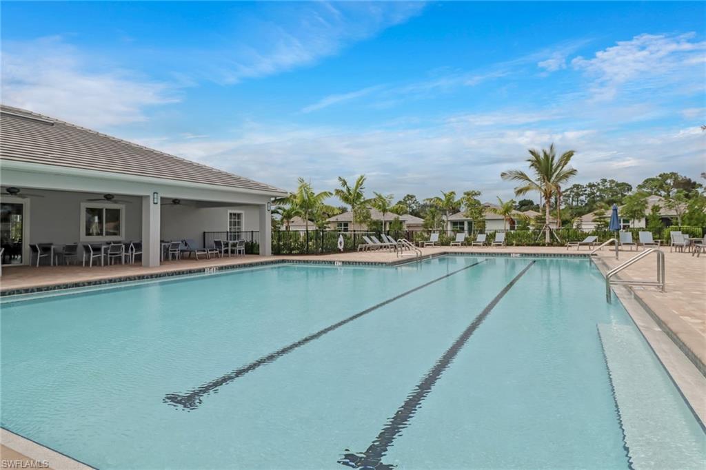 317 Spiaggio Court Naples, FL 34114 - Photo 36 of 46 a view of a swimming pool with a lounge chair