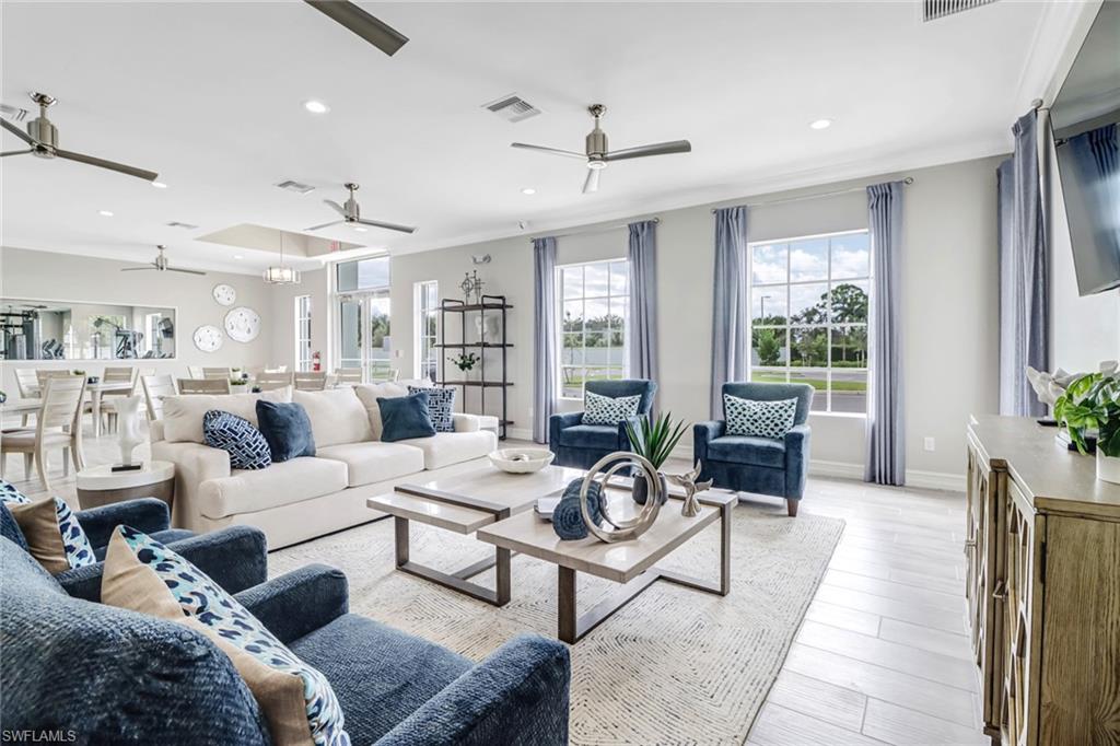 317 Spiaggio Court Naples, FL 34114 - Photo 38 of 46 a living room with furniture and a large window