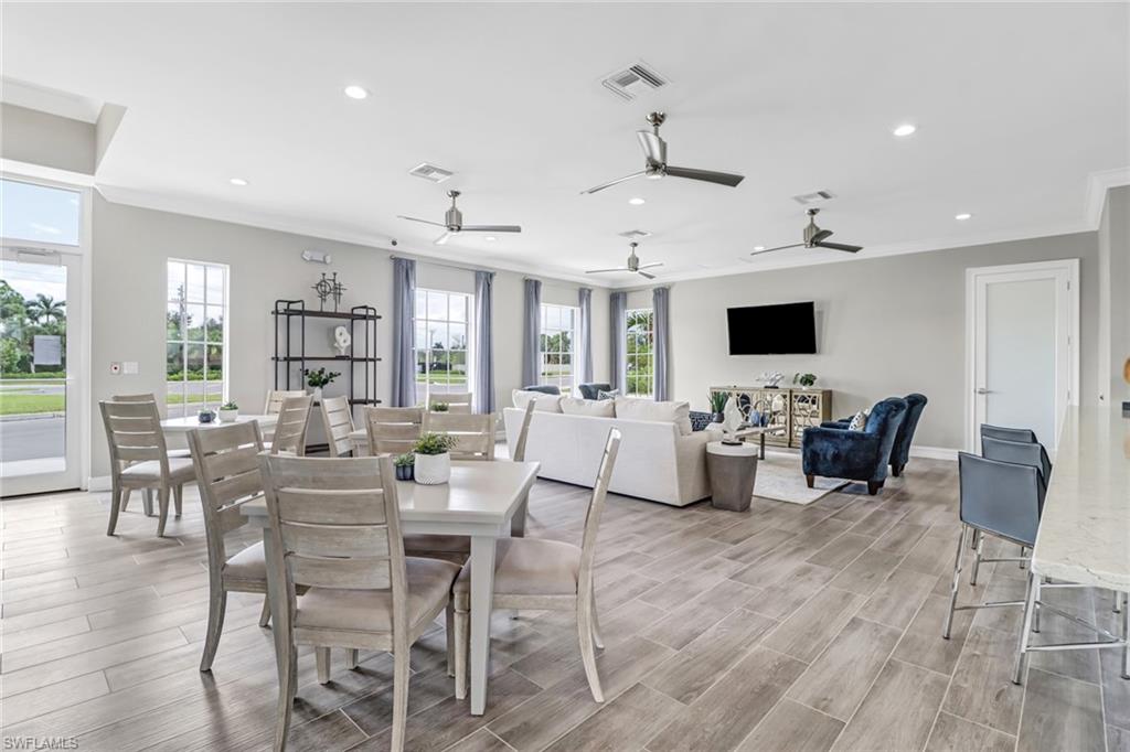 317 Spiaggio Court Naples, FL 34114 - Photo 41 of 46 a view of a dining room with furniture window and wooden floor