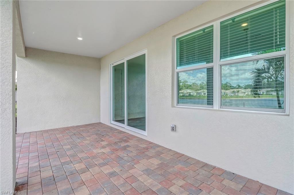 317 Spiaggio Court Naples, FL 34114 - Photo 8 of 46 a view of an empty room with a window