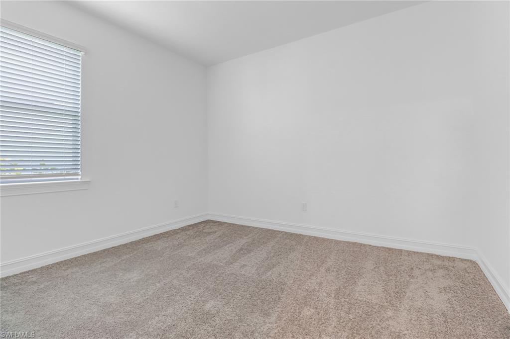 317 Spiaggio Court Naples, FL 34114 - Photo 10 of 46 an empty room with a window