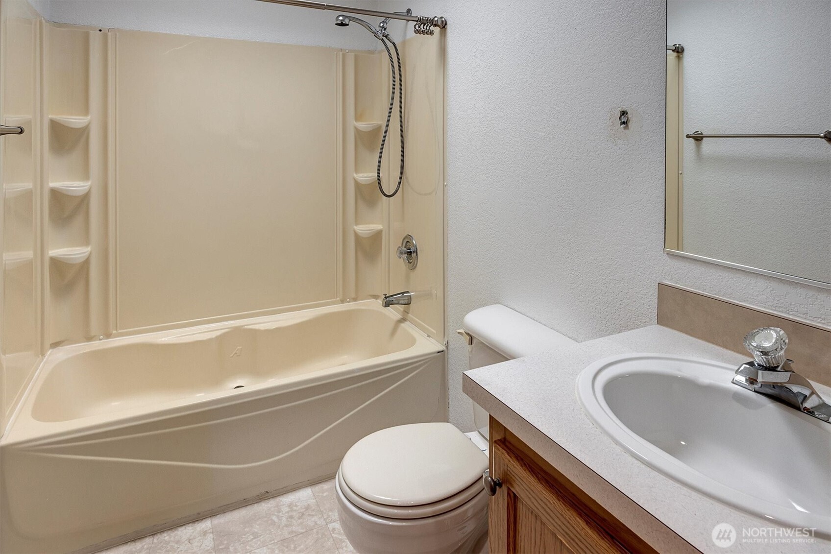 6407 Cady Road, Unit C Everett, WA 98203 - Photo 18 of 27 a bathroom with a sink a toilet and a bathtub