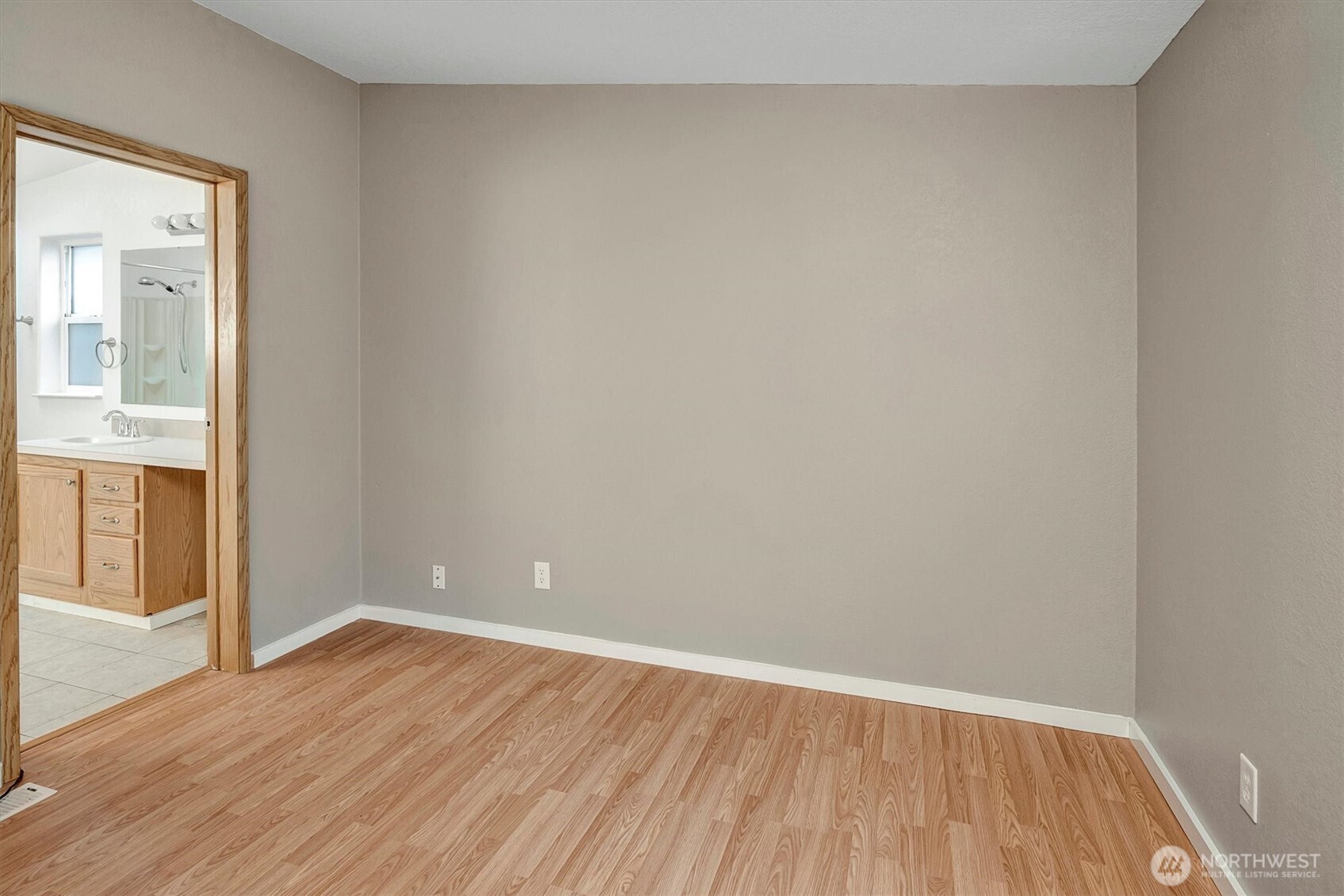 6407 Cady Road, Unit C Everett, WA 98203 - Photo 21 of 27 an empty room with wooden floor and windows