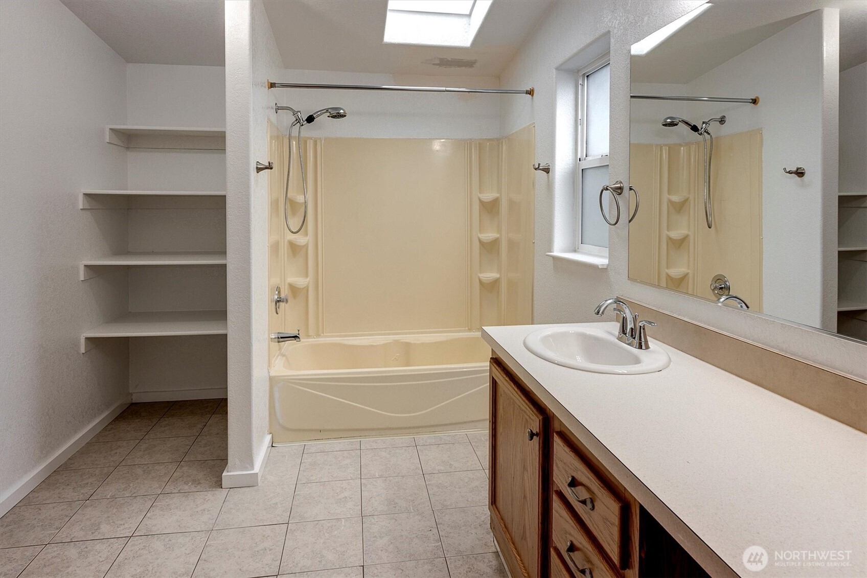 6407 Cady Road, Unit C Everett, WA 98203 - Photo 22 of 27 a bathroom with a sink a toilet and shower