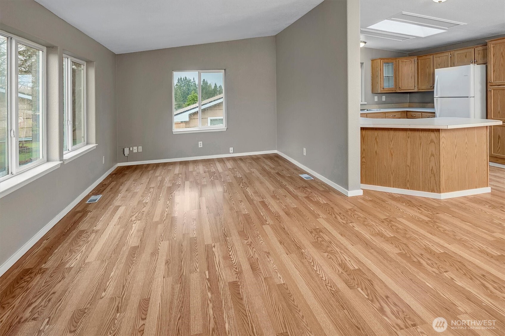 6407 Cady Road, Unit C Everett, WA 98203 - Photo 6 of 27 a view of a kitchen with wooden floor and electronic appliances