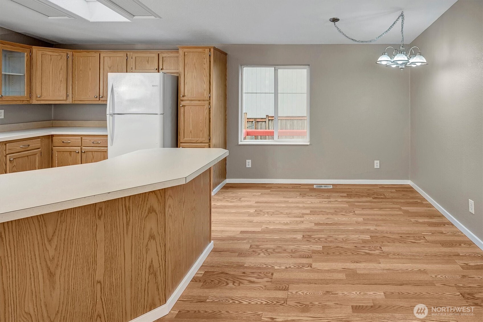 6407 Cady Road, Unit C Everett, WA 98203 - Photo 8 of 27 a kitchen with refrigerator and windows