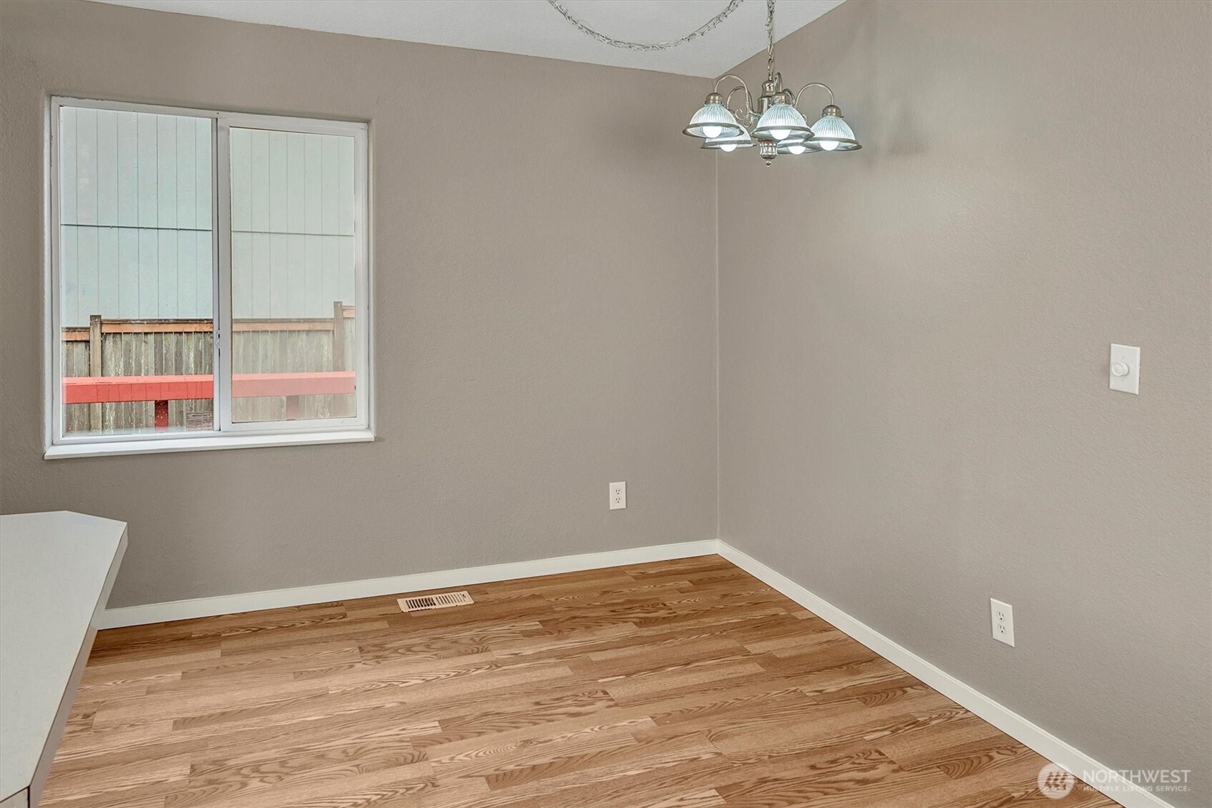 6407 Cady Road, Unit C Everett, WA 98203 - Photo 9 of 27 a view of a room with wooden floor and windows