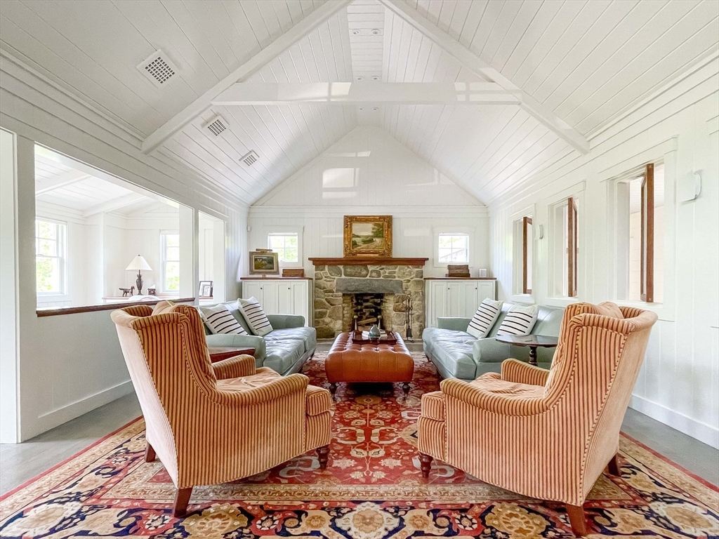 149 Litchfield Road Edgartown, MA 02539 - Photo 12 of 37 a living room with furniture a fireplace and a potted plant