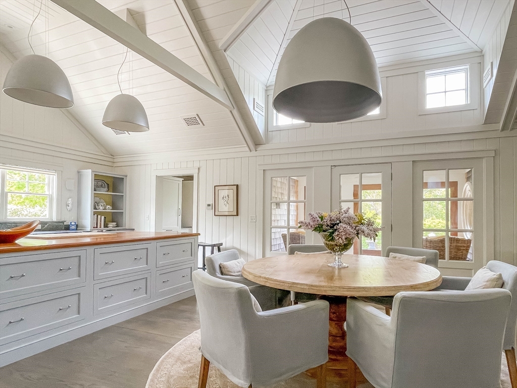 149 Litchfield Road Edgartown, MA 02539 - Photo 15 of 37 a kitchen with granite countertop a sink and cabinets