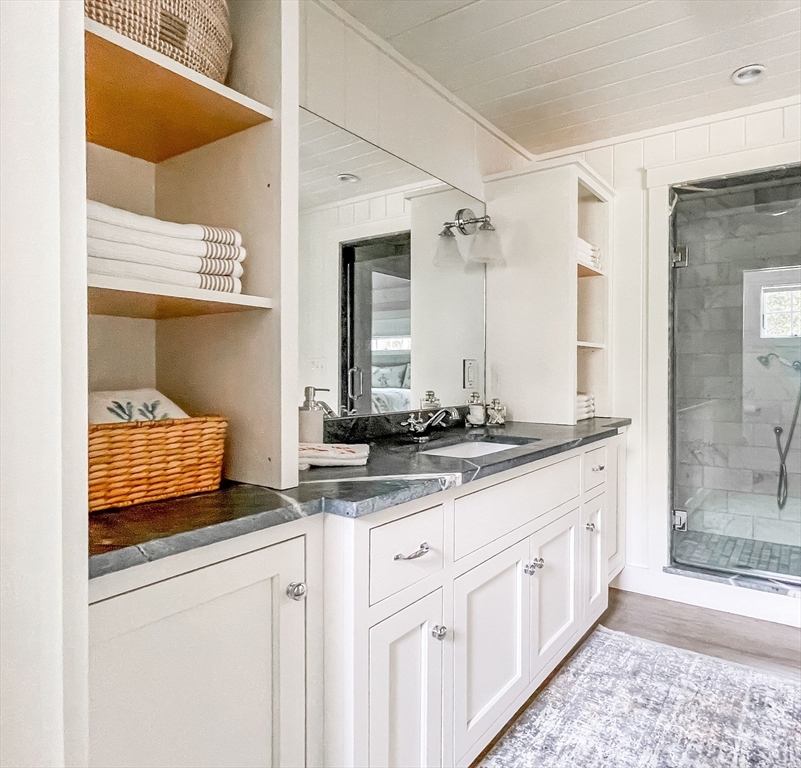 149 Litchfield Road Edgartown, MA 02539 - Photo 21 of 37 a bathroom with a sink and a mirror