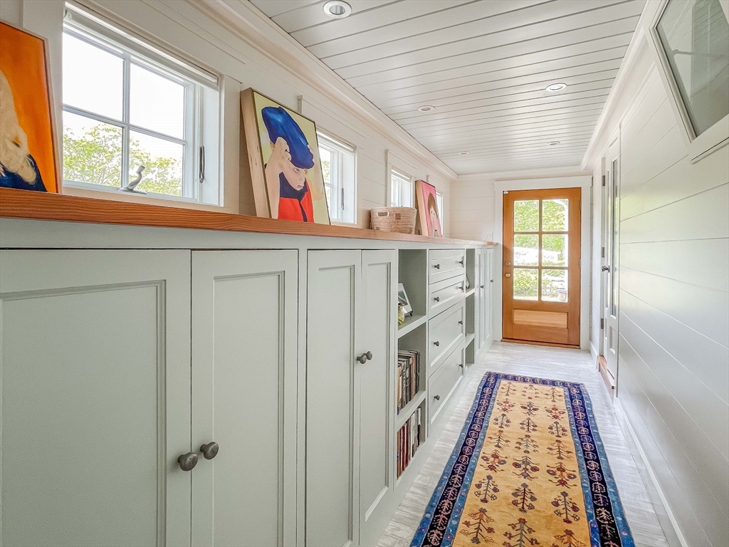 149 Litchfield Road Edgartown, MA 02539 - Photo 23 of 37 a hallway with cabinets