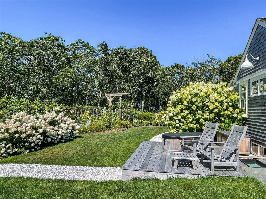 149 Litchfield Road Edgartown, MA 02539 - Photo 35 of 37 a view of a patio with table and chairs and potted plants